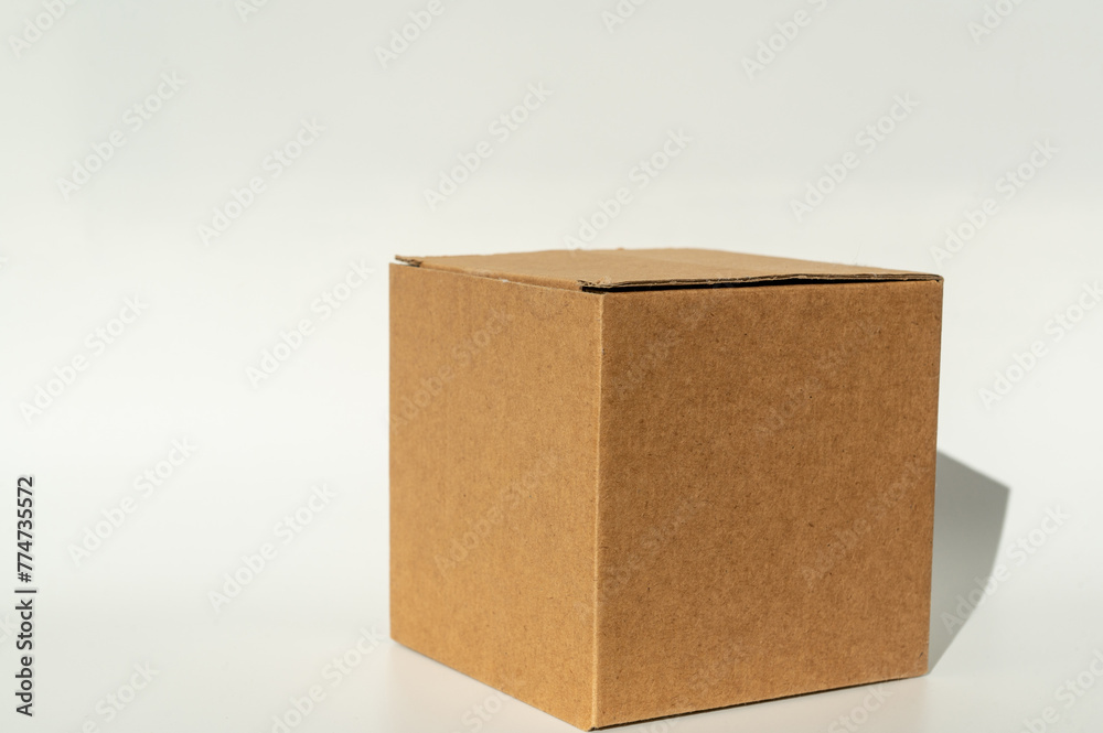 Simple brown cardboard box on white background. Simple brown cardboard box on white background.