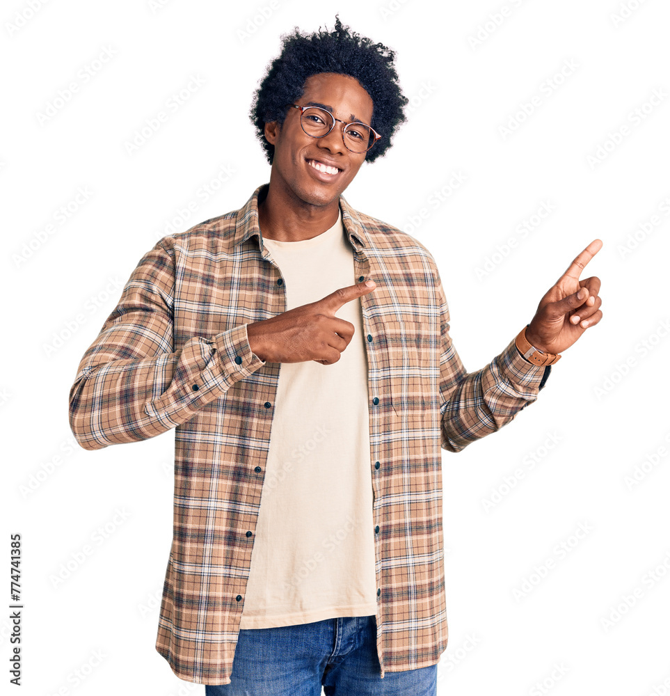 Φωτογραφία Handsome african american man with afro hair wearing casual clothes and glasses smiling and looking at the camera pointing with two hands and fingers to the side