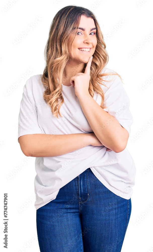 Young caucasian woman wearing casual clothes looking confident at the camera smiling with crossed arms and hand raised on chin. thinking positive. Young caucasian woman wearing casual clothes looking confident at the camera smiling with crossed arms and hand raised on chin. thinking positive.