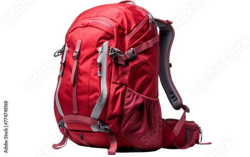 A vibrant red backpack with sturdy straps rests against a rustic backdrop