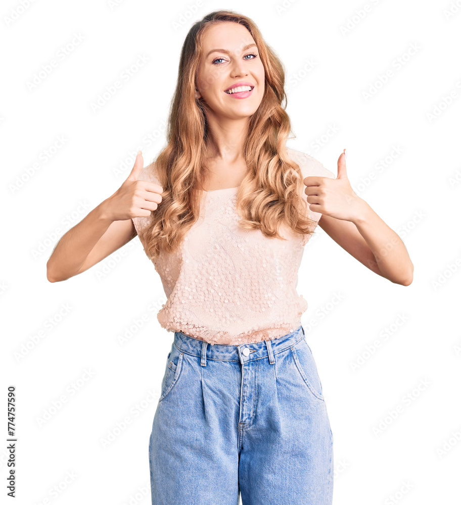 Young beautiful caucasian woman with blond hair wearing casual clothes success sign doing positive gesture with hand, thumbs up smiling and happy. cheerful expression and winner gesture. Young beautiful caucasian woman with blond hair wearing casual clothes success sign doing positive gesture with hand, thumbs up smiling and happy. cheerful expression and winner gesture.