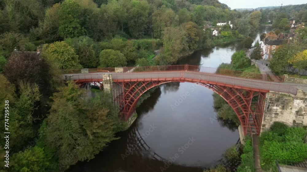 Drone shot of the Ironbridge in Telford, Shropshire, UK, with a forest in the background. Drone shot of the Ironbridge in Telford, Shropshire, UK, with a forest in the background.