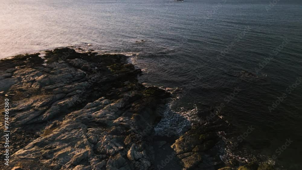 Aerial dolly above Brenton Point Newport Rhode Island at Sunrise on rocks and ocean Aerial dolly above Brenton Point Newport Rhode Island at Sunrise on rocks and ocean