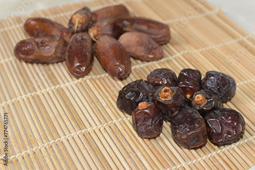 Two type of date fruit, Lulu and Tunisian dates. Lulu type is much smaller and dark compared to the Tunisian type.