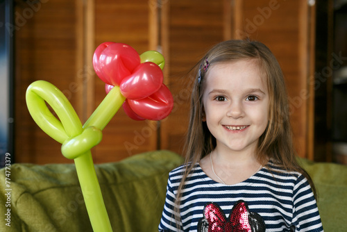 Little girl with balloons flower