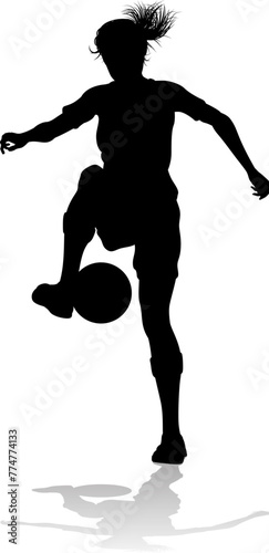 A female soccer football player woman in silhouettes