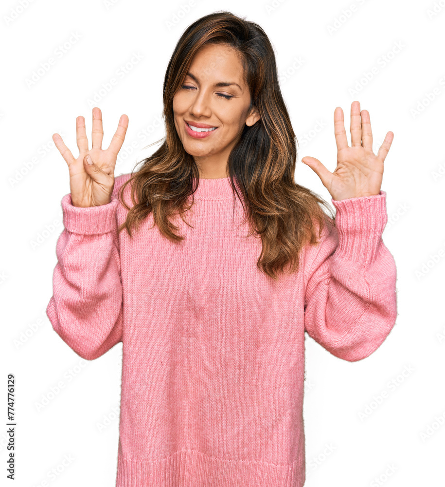 Young hispanic woman wearing casual clothes showing and pointing up with fingers number nine while smiling confident and happy. Young hispanic woman wearing casual clothes showing and pointing up with fingers number nine while smiling confident and happy.