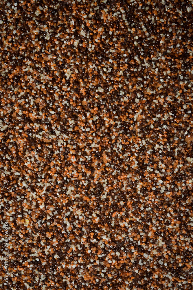 Brown sand background. Textured sand surface. Brown sand background. Textured sand surface.
