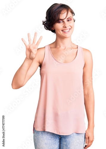 Beautiful young woman with short hair wearing casual style with sleeveless shirt showing and pointing up with fingers number four while smiling confident and happy.