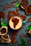 The concept of importing or exporting coffee from America. A cup of Americano coffee with an image of South America. Set of beans and ground coffee.