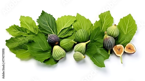Dried figs and green leaves arranged on white back
