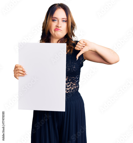Konstfotografi Young beautiful caucasian woman holding cardboard banner with blank space with a
