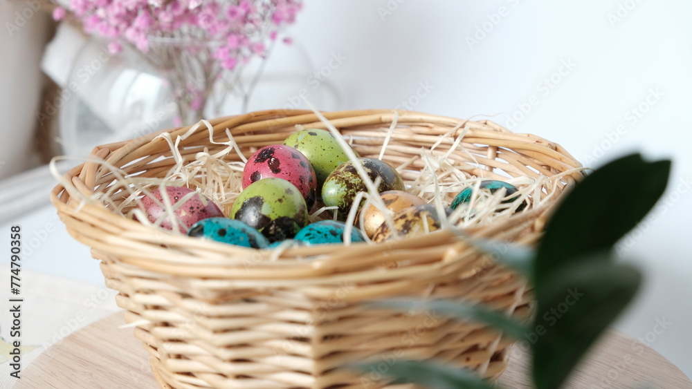 Easter quail eggs in a basket. Easter composition. Holiday concept.