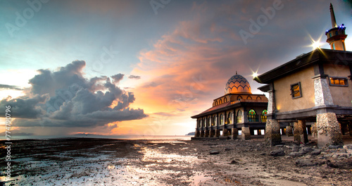 Masjid Al Hussain is a floating mosque in Kuala Perlis, Perlis, Malaysia.  Indeed, prayer has been decreed upon the believers a decree of specified times, Travel and tourism image. photo