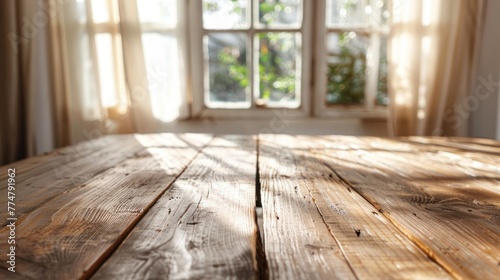 Polished wooden table with reflections of a bright window