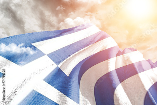 Greece national flag cloth fabric waving on beautiful cloudy Background.