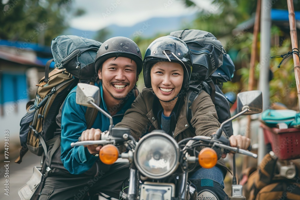 Couple Sitting on Motorcycle on Beach Couple Sitting on Motorcycle on Beach