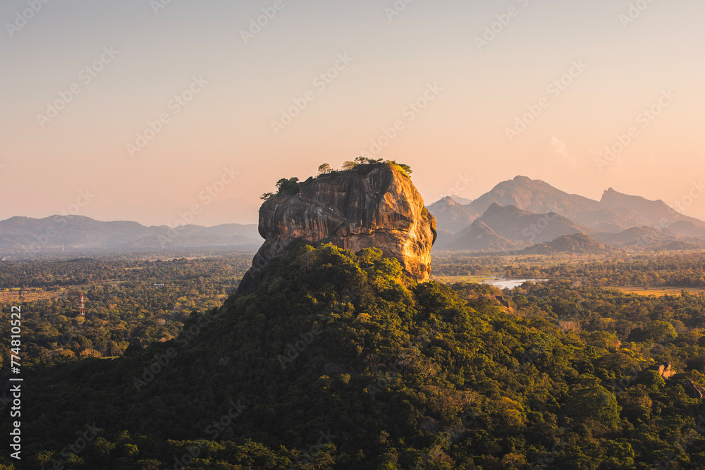 Sigiriya rock also known as Lion Rock at golden light of sunset. Beautiful landscape in Sri lanka..