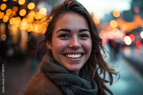 Portrait of a beautiful young woman in the city streets at night