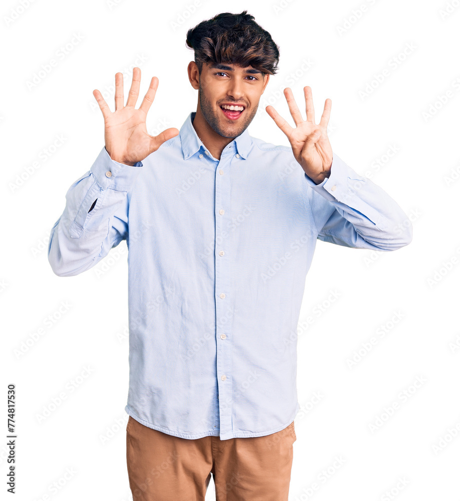 Young hispanic man wearing casual shirt showing and pointing up with fingers number nine while smiling confident and happy. Young hispanic man wearing casual shirt showing and pointing up with fingers number nine while smiling confident and happy.
