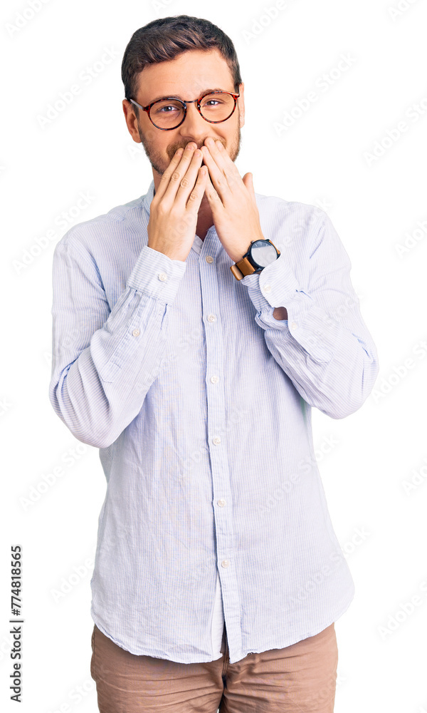 Handsome young man with bear wearing elegant business shirt and glasses laughing and embarrassed giggle covering mouth with hands, gossip and scandal concept Handsome young man with bear wearing elegant business shirt and glasses laughing and embarrassed giggle covering mouth with hands, gossip and scandal concept