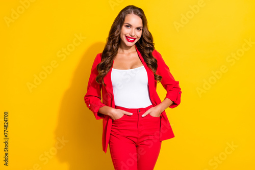 Photo of young fancy pretty business lady arm in pocket intelligent employer isolated over yellow color background