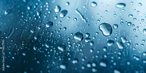 water drops on blue background A bunch of water droplets are on a window space for text