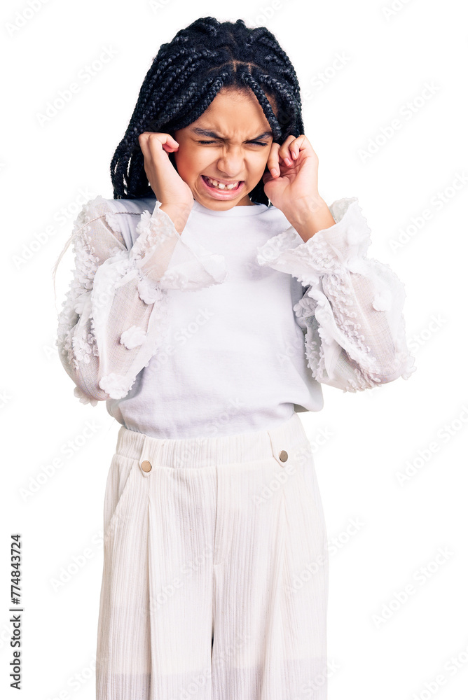 Cute african american girl wearing casual white tshirt covering ears with fingers with annoyed expression for the noise of loud music. deaf concept. Cute african american girl wearing casual white tshirt covering ears with fingers with annoyed expression for the noise of loud music. deaf concept.
