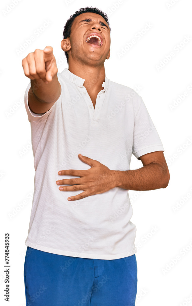 Young arab man wearing casual clothes laughing at you, pointing finger to the camera with hand over body, shame expression Young arab man wearing casual clothes laughing at you, pointing finger to the camera with hand over body, shame expression