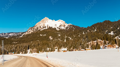 Alpine view on a sunny winter day at Graen, Tannheimer Tal valley, Reutte, Tyrol, Austria photo