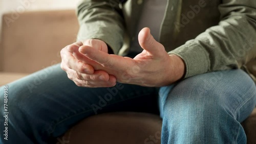 Close-up of Man With Parkinson Disease Symptom.