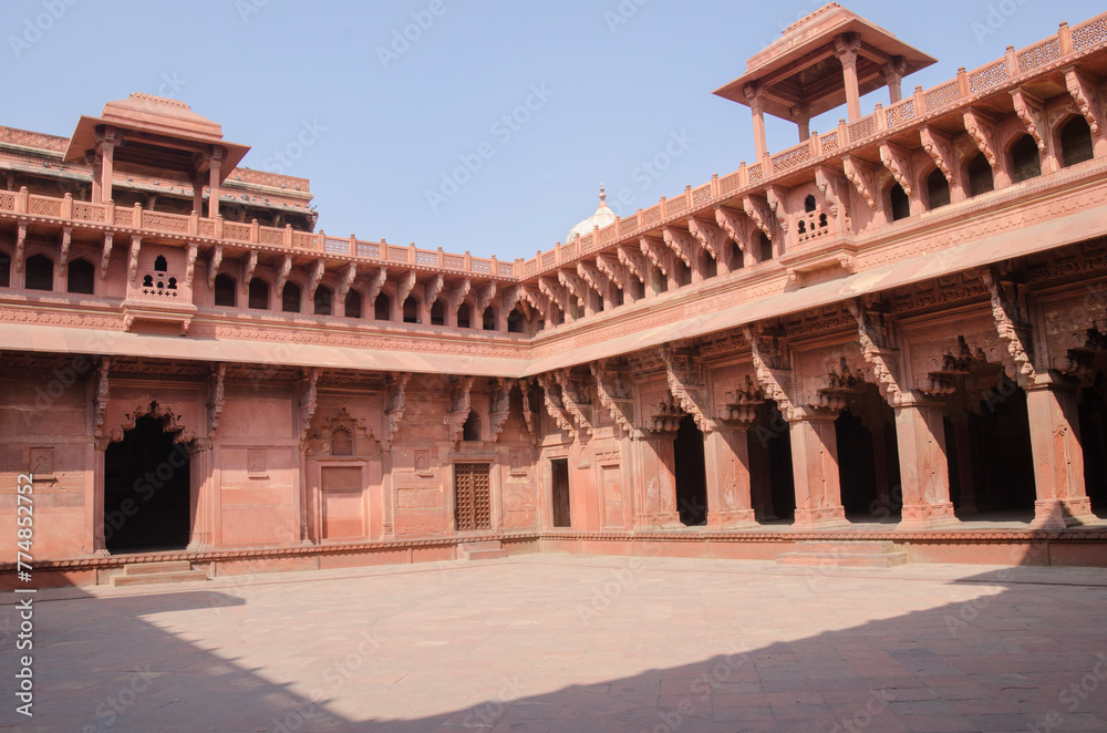 Red sandstone medieval architecture, structure with intricate carving, Red Fort, Agra, Uttar Pradesh, India.