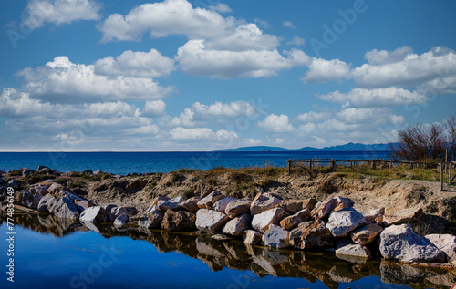 Seascape from the beach of the Sterpaia coastal park on the gulf of Follonica Tuscany Italy photo