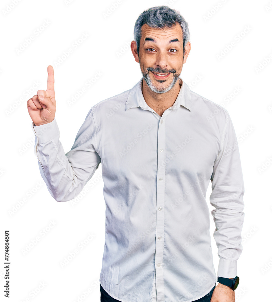 Middle age hispanic with grey hair wearing casual white shirt showing and pointing up with finger number one while smiling confident and happy. Middle age hispanic with grey hair wearing casual white shirt showing and pointing up with finger number one while smiling confident and happy.