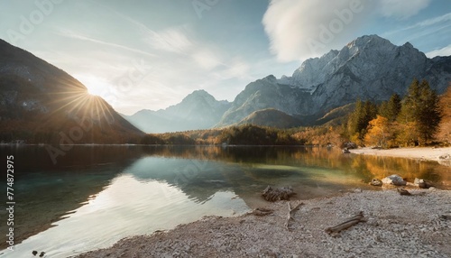awesome alpine highlands in sunny day amazing mountain lake in slovenia in sunny day famous jasna lake in julian alps wonderful nature landscape in autumn popular travel and hiking destination photo