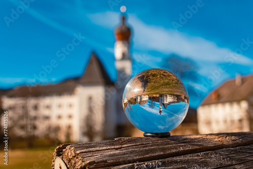 Crystal ball alpine winter landscape shot with a monastery at the famous Lake Hoeglwoerther See, Hoeglwoerth, Anger, Rupertiwinkel, Berchtesgadener Land, Bavaria, Germany photo