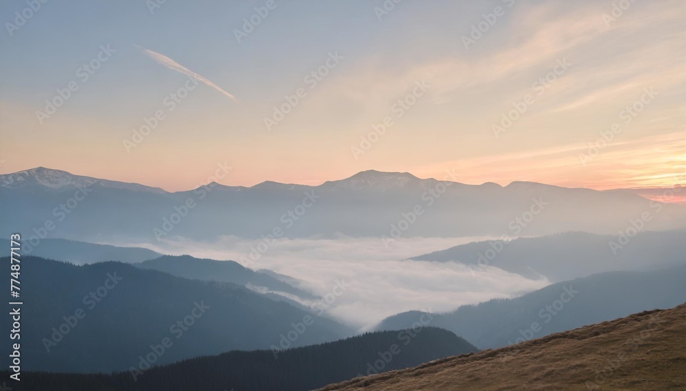 peaceful blue nature background with foggy bucegi mountains in carpathians seen from cota 2000 sinaia resort romania - obrazy, fototapety, plakaty 