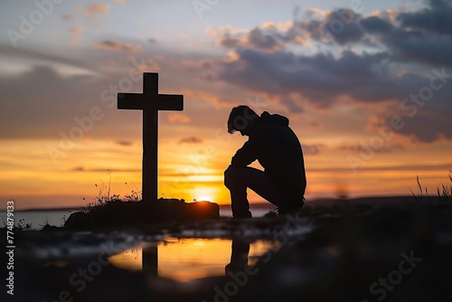 Silhouette of someone praying at the cross, deep faith in God depicted