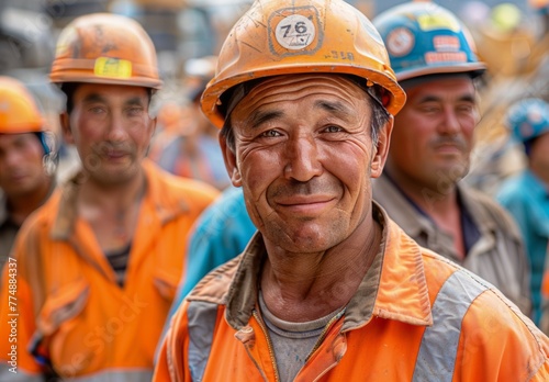 Smiling Kazakh Construction Workers: Portrait of Immigrant Labor photo