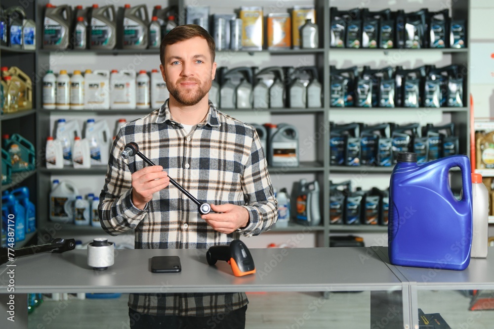 Auto parts store. The seller receives the product and evaluates the quality Auto parts store. The seller receives the product and evaluates the quality