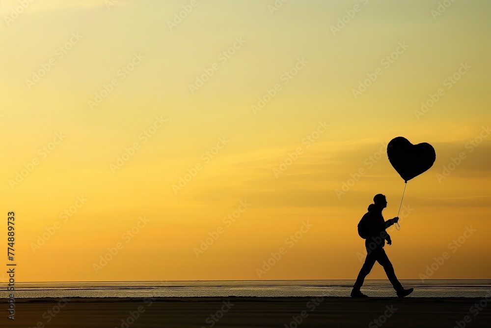 Silhouette of Person with Heart Balloon at Sunset, Romantic Beach Walk