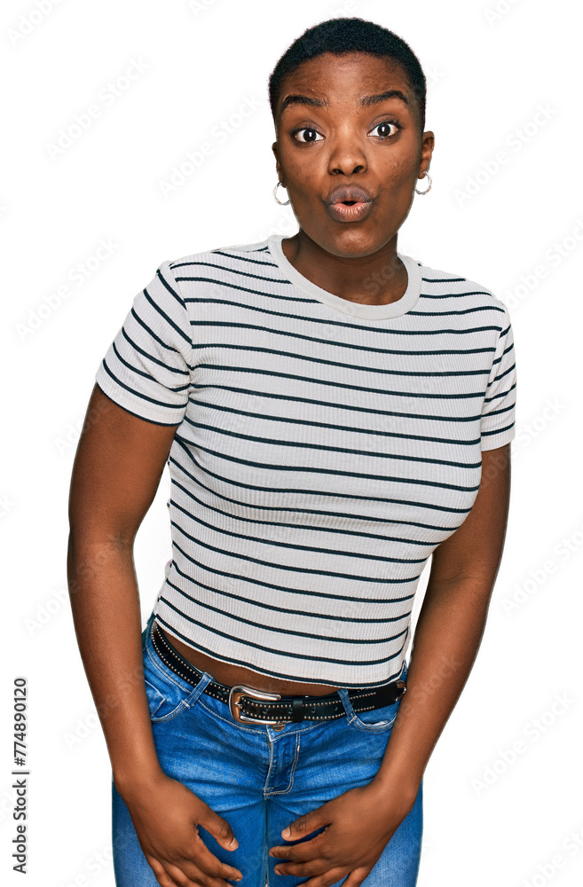 Young african american woman wearing casual clothes scared and amazed with open mouth for surprise, disbelief face Young african american woman wearing casual clothes scared and amazed with open mouth for surprise, disbelief face