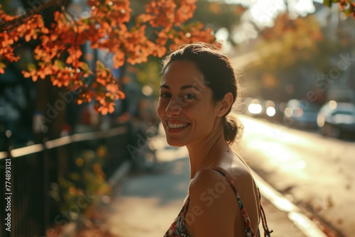 Portrait of a young beautiful woman on the street in autumn.