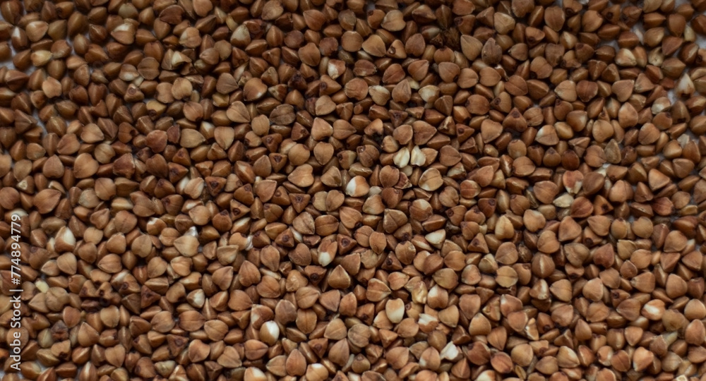 Texture of loose buckwheat on the table Texture of loose buckwheat on the table