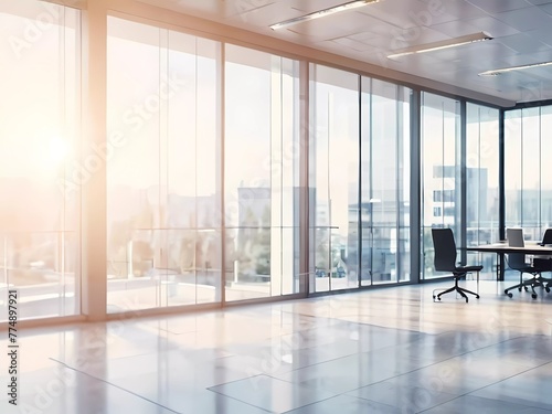 Beautiful blurred background of a light modern office interior with panoramic windows and beautiful lighting.