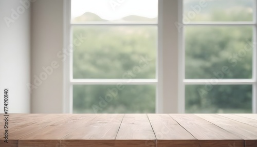 Empty wooden table with green trees background 