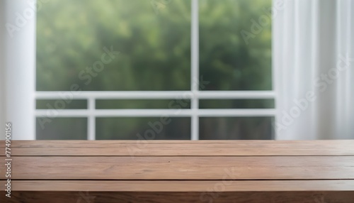 Empty wooden table with green trees background 
