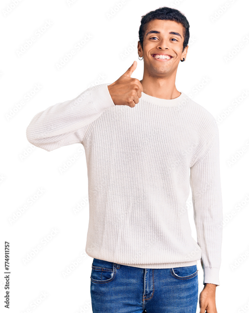Fototapeta premium Young african amercian man wearing casual clothes doing happy thumbs up gesture with hand. approving expression looking at the camera showing success.