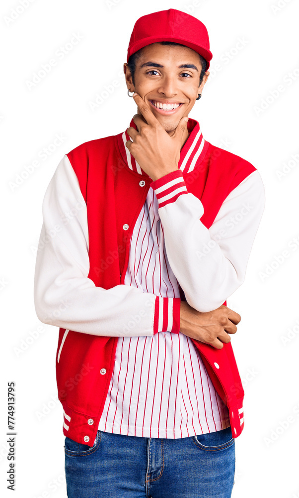 Young african amercian man wearing baseball uniform looking confident at the camera smiling with crossed arms and hand raised on chin. thinking positive. Young african amercian man wearing baseball uniform looking confident at the camera smiling with crossed arms and hand raised on chin. thinking positive.