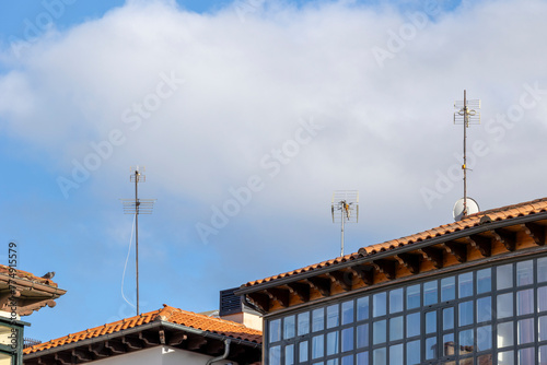 These antennas are commonly seen on residential buildings, providing access to TV signals. They dot the skyline, connecting households to news, entertainment, and sports broadcasts.